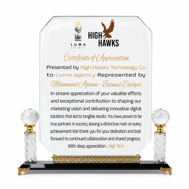 Glass certificate of appreciation mounted between two crystal columns, presented by High Hawks Technology to LUMA Agency.