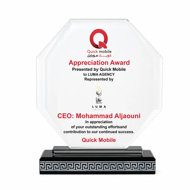 Octagonal crystal appreciation award on a black patterned base, presented by Quick Mobile to LUMA Agency.